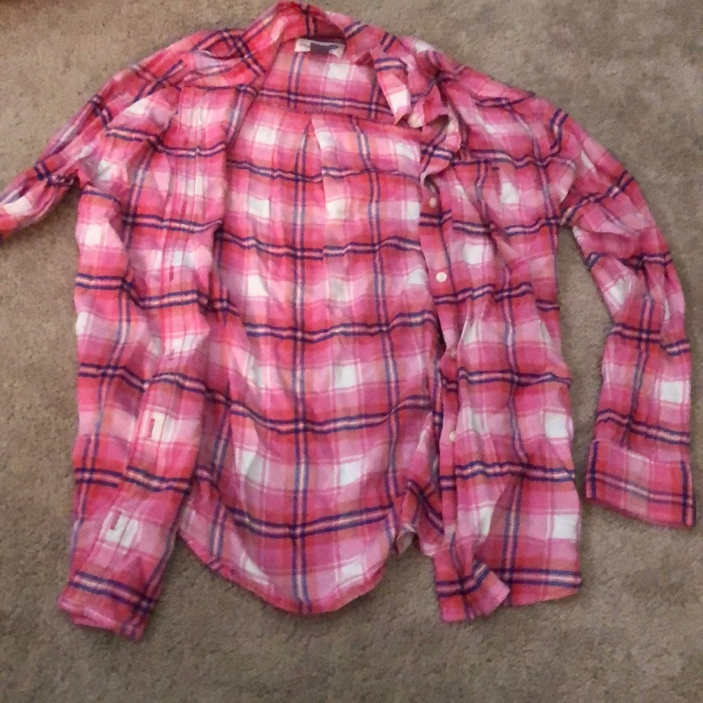 A girls pink and white long sleeve plaid shirt